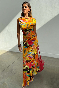 Rio A-Symmetric Skirt in a multi-coloured tropical fruit print worn by a model with a matching co-ord top.
