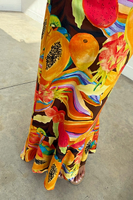 Rio A-Symmetric Skirt in a bold tropical fruit print jersey with oversized papaya and dragon fruit motifs.