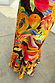 Rio A-Symmetric Skirt in a bold tropical fruit print jersey with oversized papaya and dragon fruit motifs.