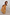Thumbnail for Yellow cotton maxi sun dress with a shirred top and sun print pattern worn by a young girl.