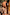 Thumbnail for Boy wearing yellow sun swim shorts with a white and orange soleil print in a sunny outdoor setting.