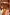 Thumbnail for Slip bikini Abstract con stampa multicolore vivace e piccolo ciondolo logo metallico sul retro.