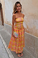 Model wears the Multi Check Lola Mid-axi Dress in yellow, pink and orange with a ruched bodice and thin straps.