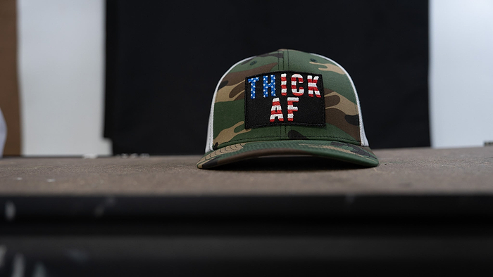 Veteran made camo patch snapback hat.