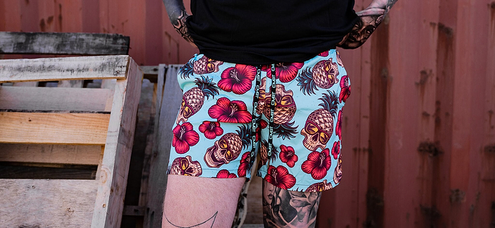 A man in Combat Iron hybrid swimming shorts