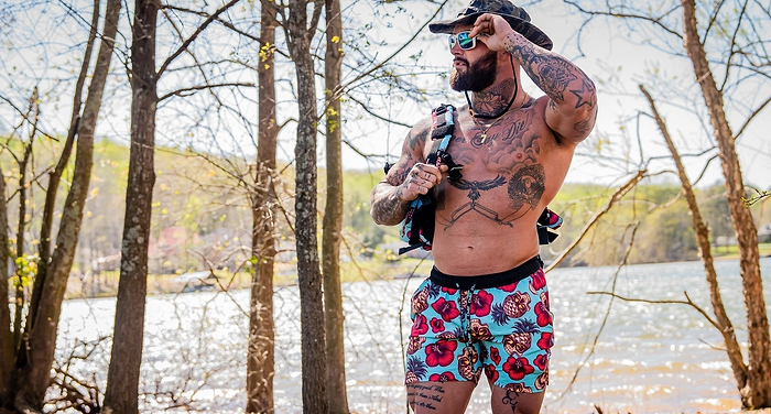 A man in combat Iron apparel swimming shorts