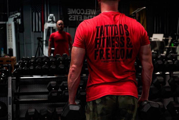Man in gym with workout shirt.