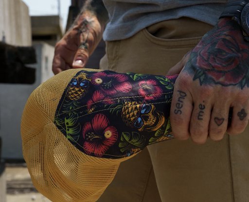 Man holding a durable ripstop hat.