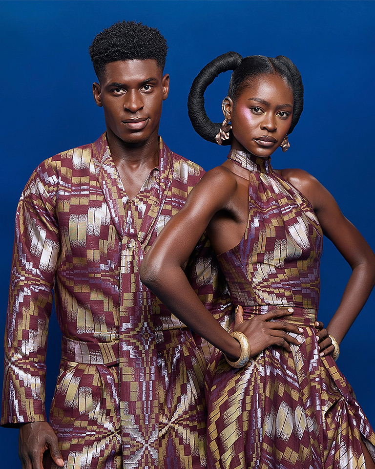 A man and a woman dressed in Radiance fabric in front of a blue background