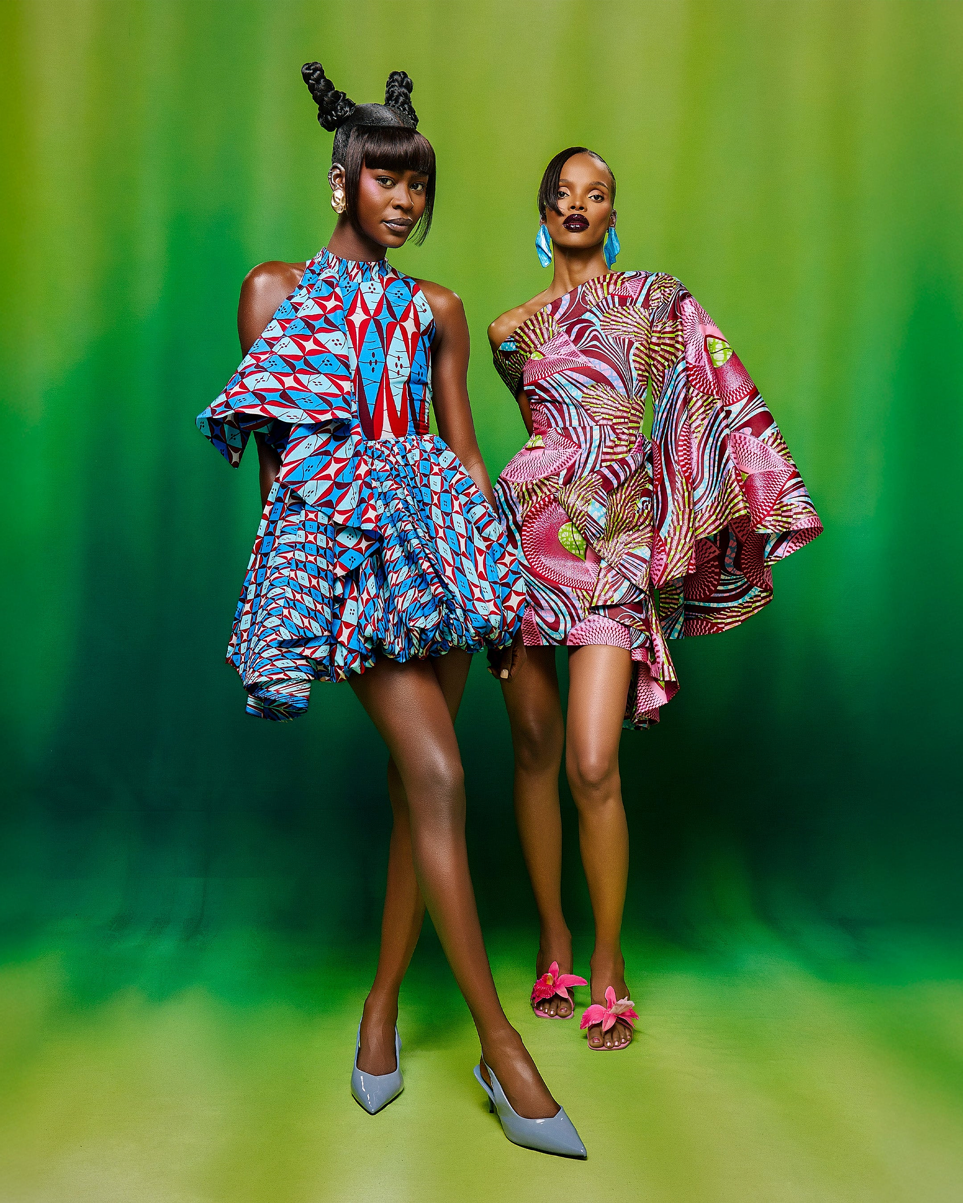 Two models wear vibrant asymmetrical wax hollandais vlw9503.009