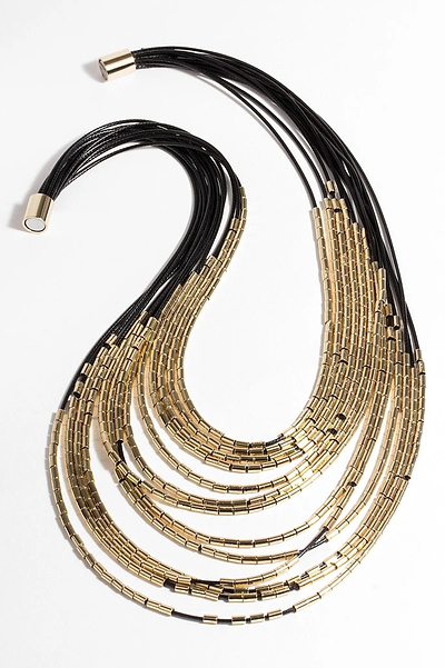 long layered necklace with gold beads