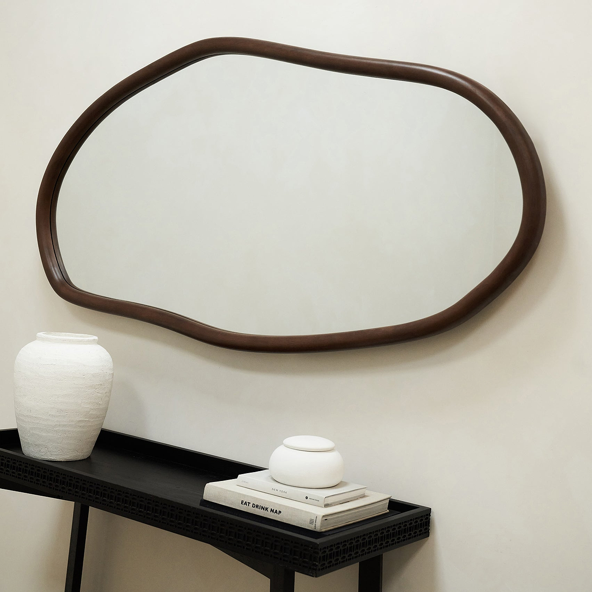 Dark Wood Organic Irregular Wooden Wall Mirror hanging on wall