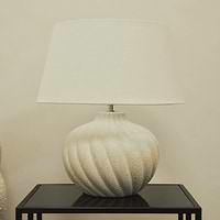 Textured ceramic based table lamp natural shade on brookyln side table