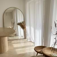 Gold Full Length Arched Metal Mirror in living room