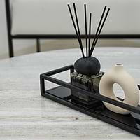 Detail shot of Black modern large rectangle tinted mirrored decorative tray on Artemis travertine table
