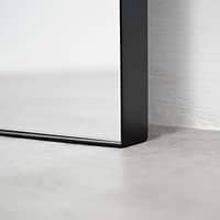 Full length black large metal mirror closeup