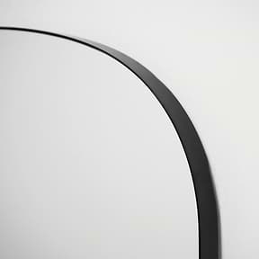 Full length black large metal mirror closeup