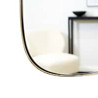 Gold metal stone shaped irregular wall mirror closeup