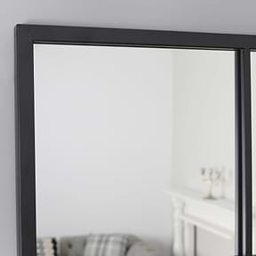 A detail of this mirrors stylish frame.