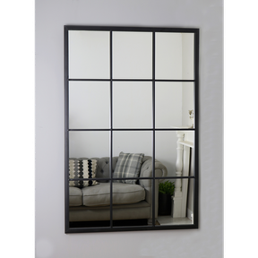 An overall view of this mirror mounted to a wall.