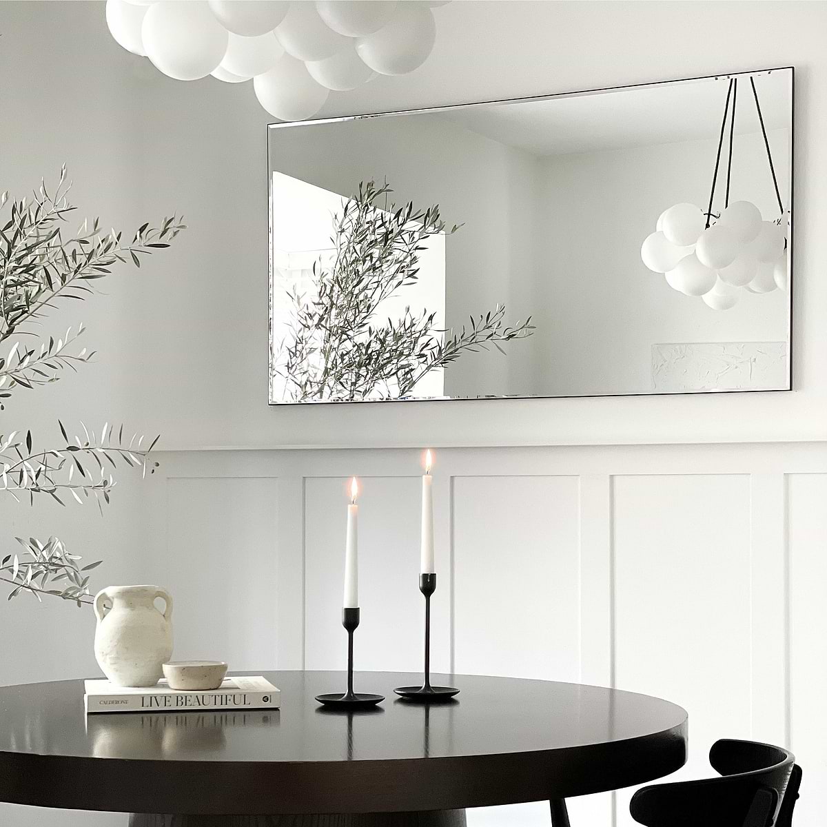 Large Frameless Rectangular Console Mirror displayed on wall above table