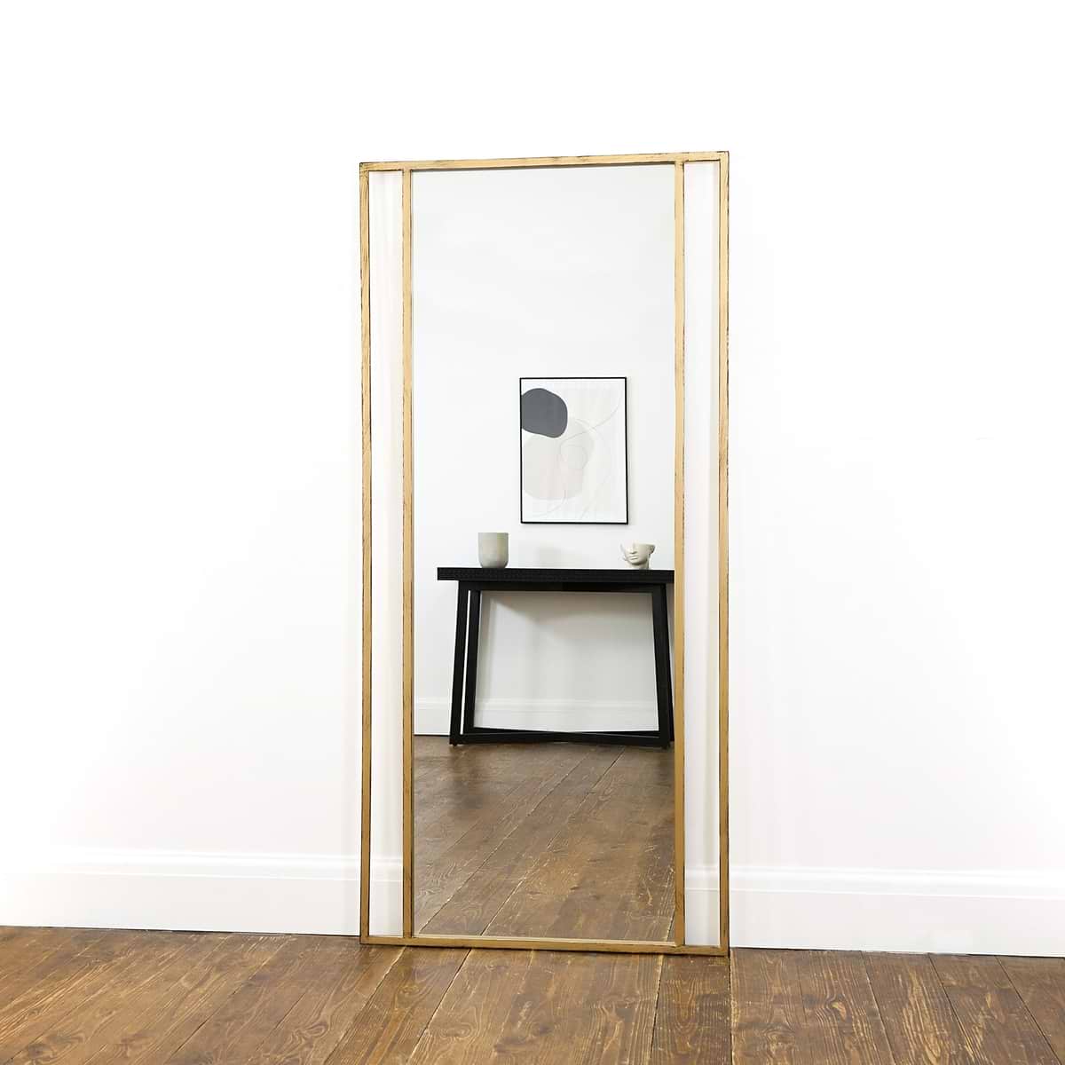 Full Length Gold Metal Mirror reflecting console table