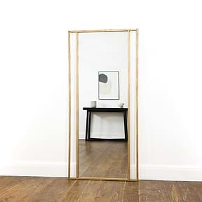 Full Length Gold Metal Mirror reflecting console table