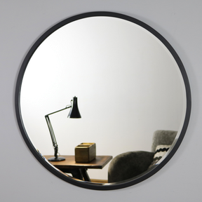 Black Metal Modern Round Wall Mirror reflecting lounge