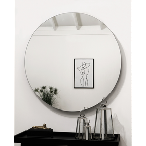 Large Frameless Round Wall Mirror reflecting painting
