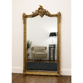 Gold Arched Ornate Full Length Mirror leaning against wall