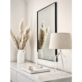 Black Rectangular Metal Wall Mirror beside ceramics