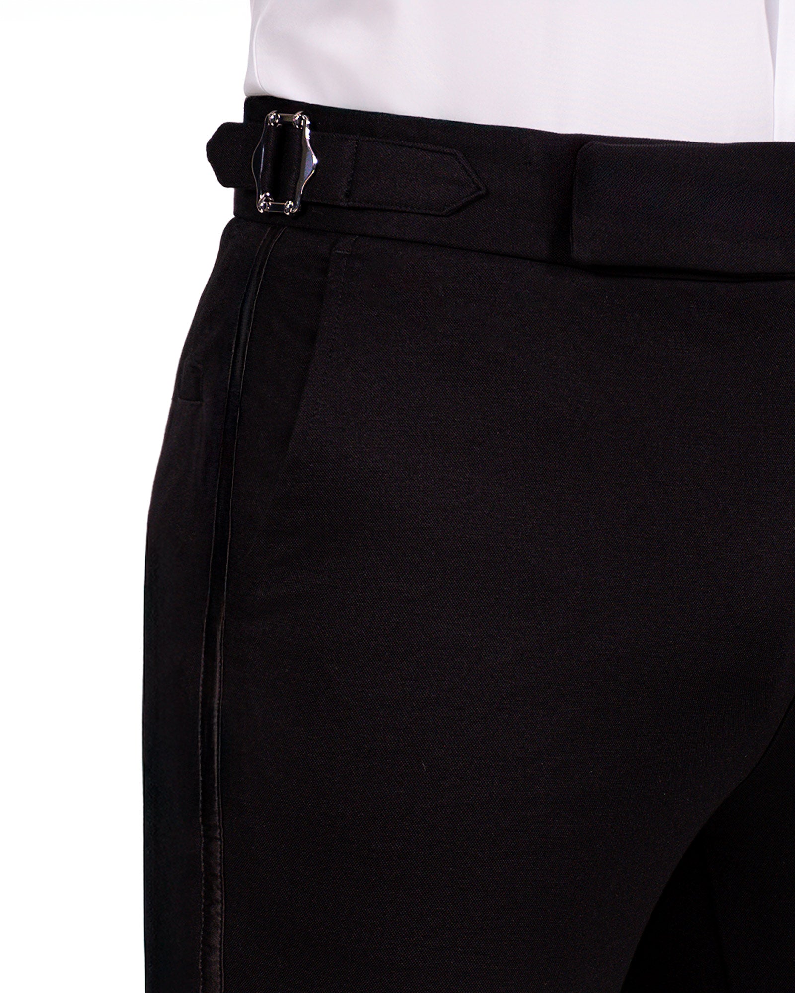 Close-up of black pants with a belt on a white background