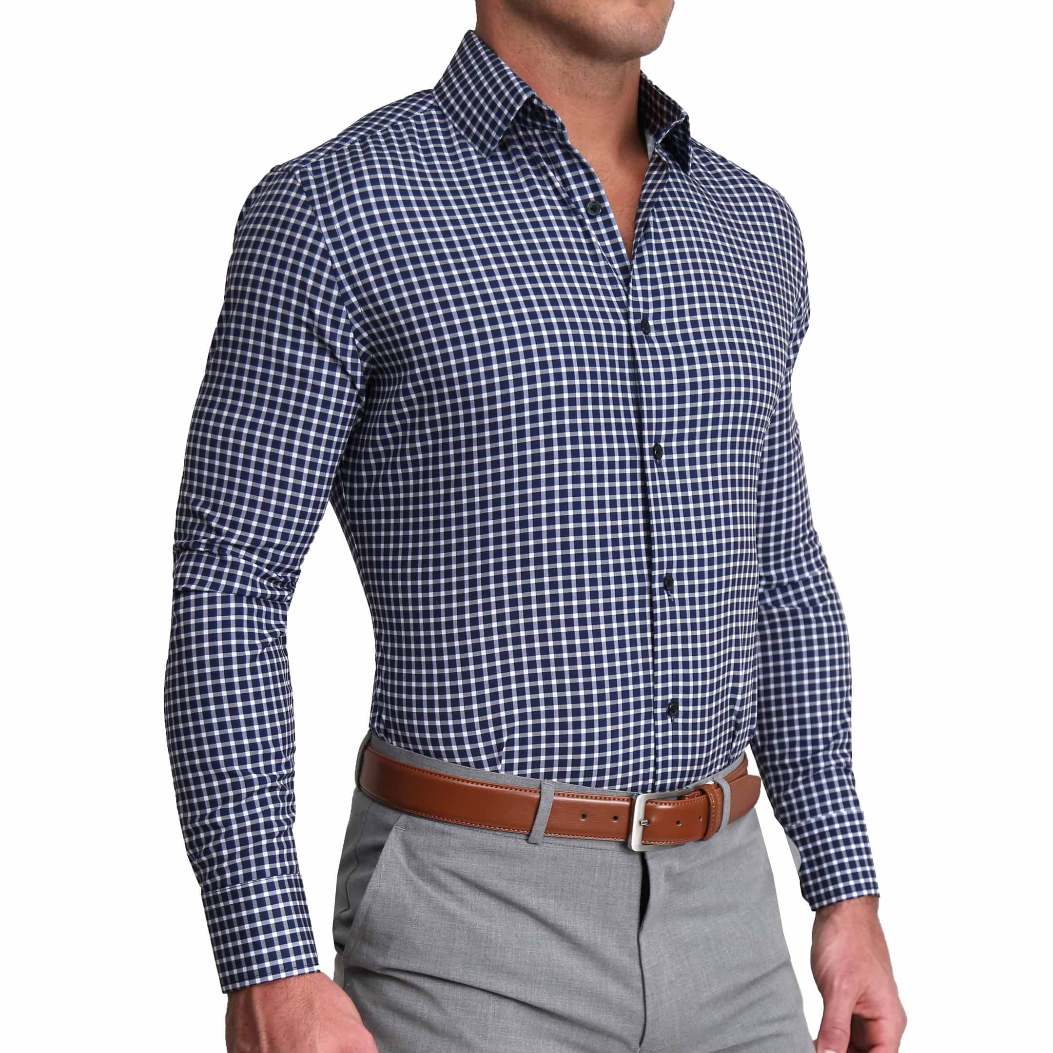 A man wearing a blue and white mini plaid dress shirt with a structured collar and single button cuffs.