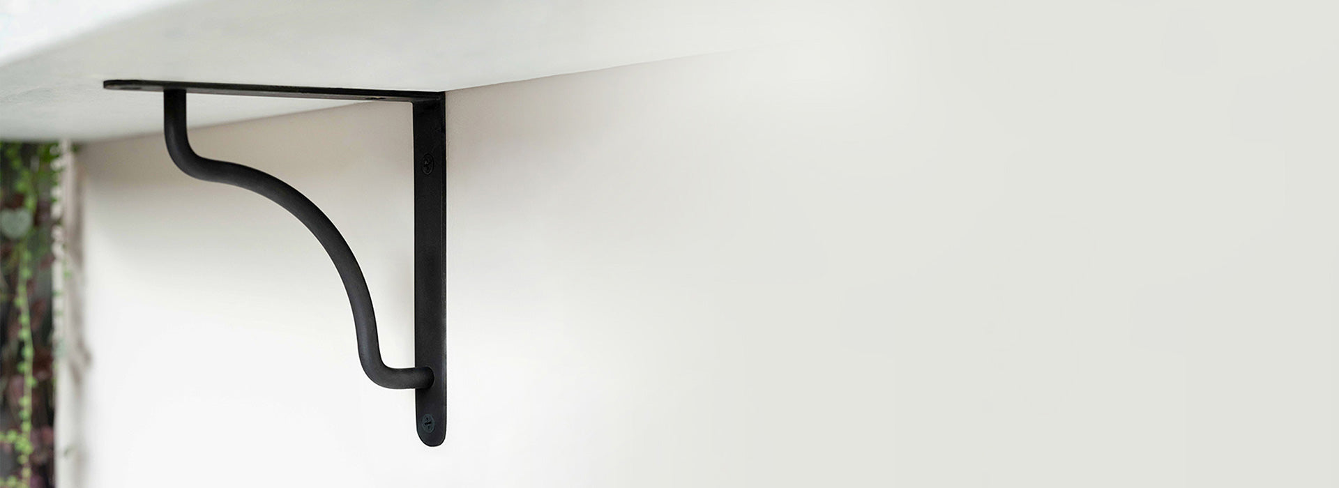 bronze shelf brackets with white marble shelves