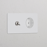 Zweifachrahmen mit Kipphebelschalter und Schuko Typ F Steckdose, lackierbar, poliertes Nickel und Weiß.