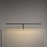 Harrow schilderijverlichting 580mm - Brons, wandlamp die een schilderij op een beige muur elegant verlicht.