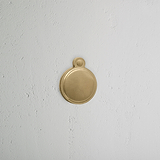 Antique Brass Warwick Covered Key Escutcheon on White Background