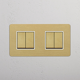Four Position Double Rocker Switch in Antique Brass White on White Background