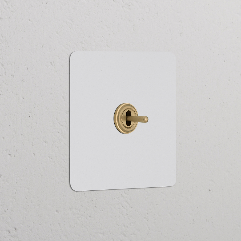 'Bouton Poussoir Trois Positions à Levier en laiton ancien, interrupteur simple avec plaque peignable.'