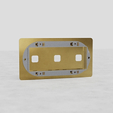 Triple Switch Plate in Antique Brass - Timeless European Home Accessory on White Background