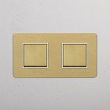 Two Position Double Rocker Switch in Antique Brass White on White Background