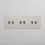 Super Capacity Light Toggle Switch: Polished Nickel Triple 6x Toggle Switch on White Background