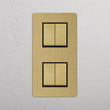 Four-Switch Vertical Double Rocker, Antique Brass Black Hue on White Background