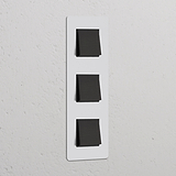 Interrupteur triple vertical en bronze avec insert noir, assorti à 'Interrupteur VV Carré x3 Vertical (Plaque Triple)'.