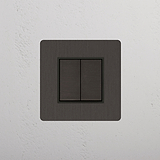 Dual-Position Rocker Switch in Bronze Black on White Background