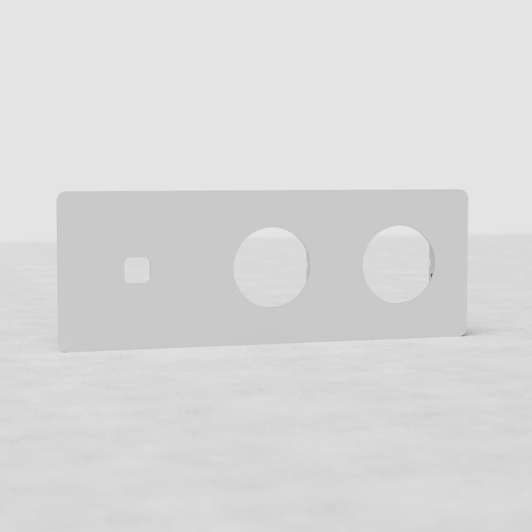 Plaque Interrupteurs Peignables UE à triple insert : interrupteur x1 et insert rond x2, sur surface lumineuse.