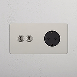 Zweifachrahmen rund in poliertem Nickel mit 2x Kipphebel & 1x SchuKo-Modul in Schwarz.