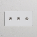 Zweifachrahmen mit 3x Kipphebelschalter in lackierbarem und poliertem Nickel, passend für Schalter und Dimmer.