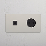 Tomas de pared de doble marco en níquel pulido con salidas USB y Schuko de 30 W con inserto negro.
