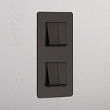 Interruptor doble de balancín de alta capacidad, en bronce y negro con diseño vertical y cuatro posiciones - Detalle para el hogar